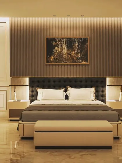 This bedroom render exudes warmth and classic elegance. The design incorporates wall paneling, a tufted headboard, and a mix of ambient and task lighting to create a layered, luxurious, and comfortable environment.