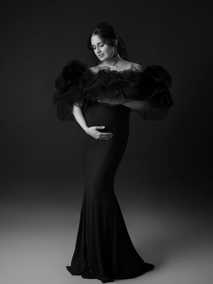 A timeless and graceful solo portrait, where the black and white tones highlight the emotion of the moment.