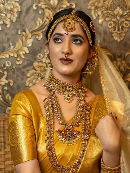 A close-up of the makeup from a student's portfolio shoot. We teach how to balance bold eyes and lips with traditional jewellery.
