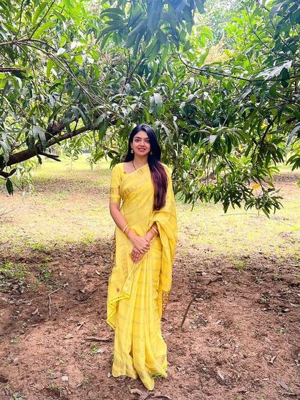 Vinathi mam looking like sunshine in her yellow saree, surrounded by nature. It's moments like these that make my work so rewarding.