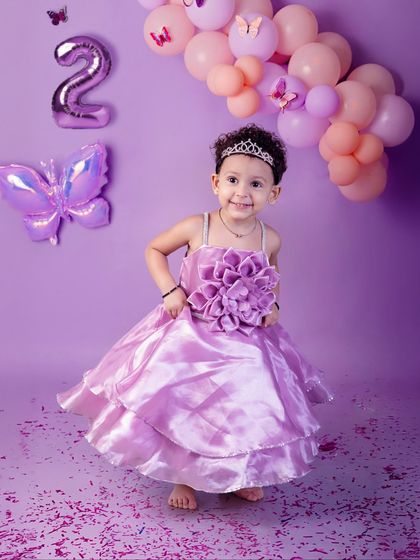 Twirling into her second year. This butterfly-themed second birthday shoot was full of princess twirls, confetti, and happy smiles.