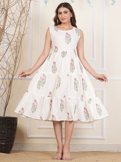 A front view of the white floral tiered dress, perfect for a fresh and summery look.