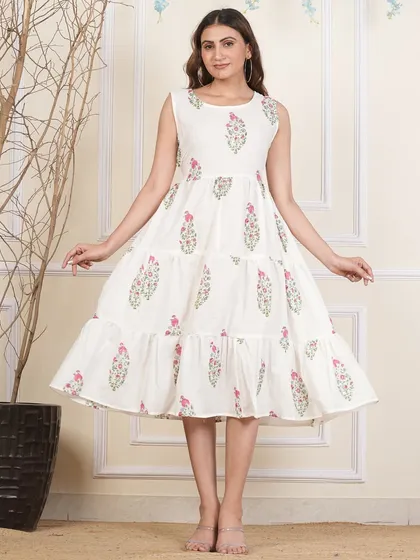 A front view of the white floral tiered dress, perfect for a fresh and summery look.
