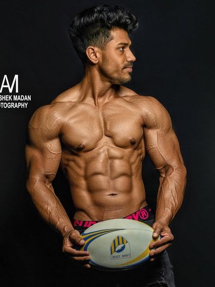 The final photoshoot result. This professional shot captures the incredible muscle definition, vascularity, and conditioning achieved through the 16-week plan.