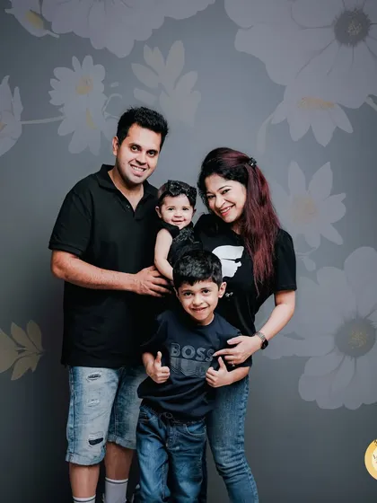 A fun and relaxed portrait of a family of four. We encourage families to be themselves, resulting in genuine smiles and a photo that truly represents their dynamic.