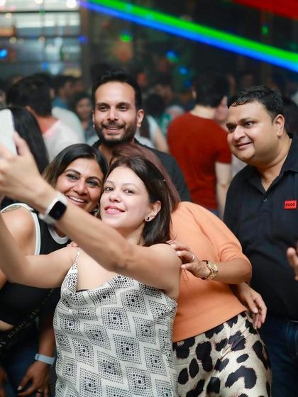 A selfie moment amidst the party. Capturing the good times.