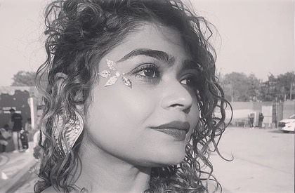 A delicate silver gem leaf design by the eye. This black and white photo shows how the design's shape stands out.