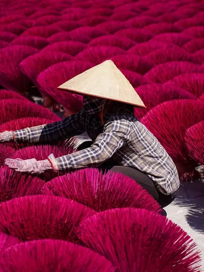 A close-up of a worker arranging the incense sticks. It's a craft that has been passed down for centuries, and I feel privileged to document it.