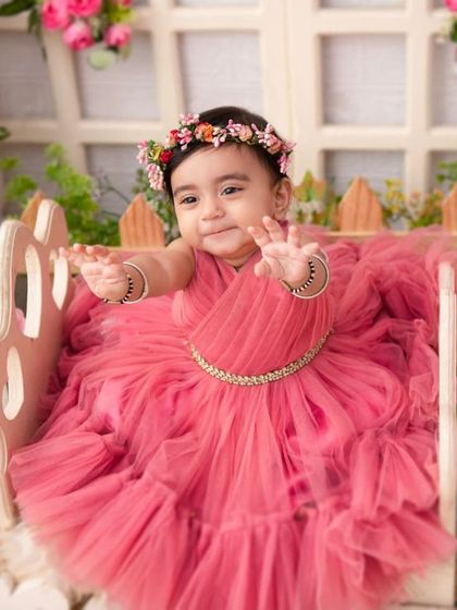 A princess in her garden. The pink floral theme is a classic choice for a girly and beautiful milestone session.