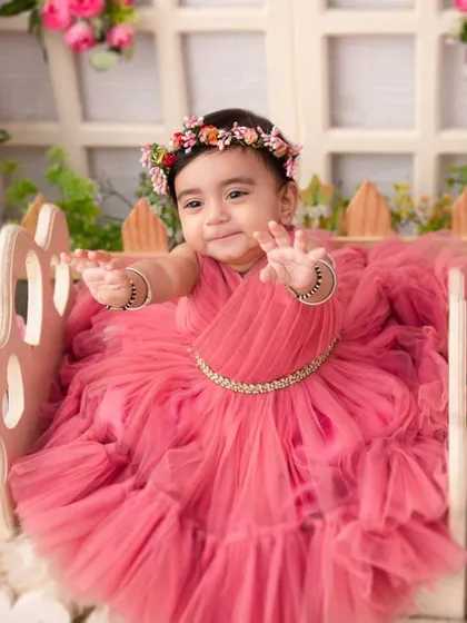 A princess in her garden. The pink floral theme is a classic choice for a girly and beautiful milestone session.