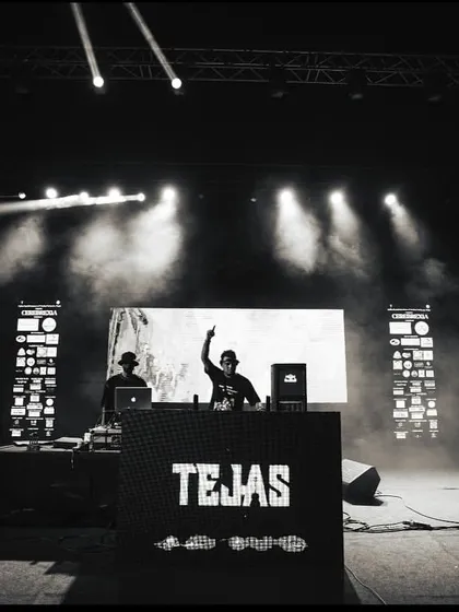 A black and white shot from the DJ booth at IGIMS Patna, capturing the stage and lighting setup.