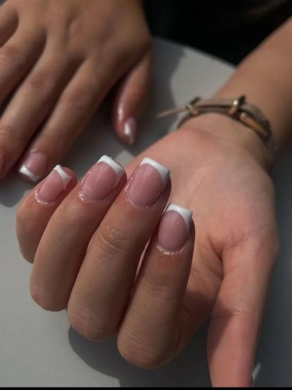 A classic French manicure on medium-length square nails, a versatile and popular choice for any occasion.