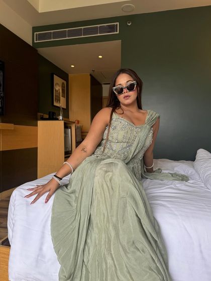 Putting on the final touches. A pair of stylish sunglasses adds that extra bit of personality to my look, even when I'm just getting ready in my hotel room.