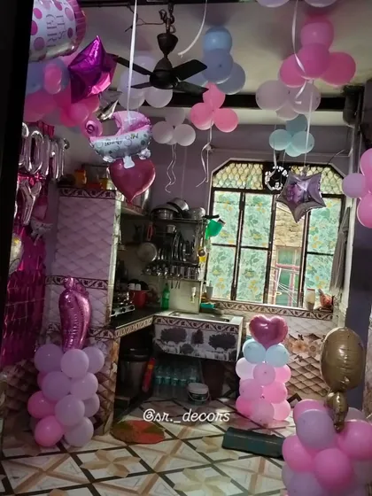 This image shows how I can decorate a larger area of a room. The setup includes balloon pillars, ceiling balloons, and character foils to create a complete party atmosphere for welcoming your little one home.