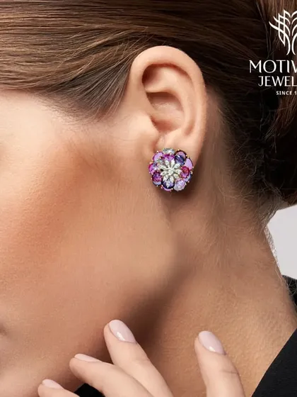 A beautiful pair of floral stud earrings featuring a rainbow of colourful gemstones, perfect for adding a vibrant touch to any ensemble.