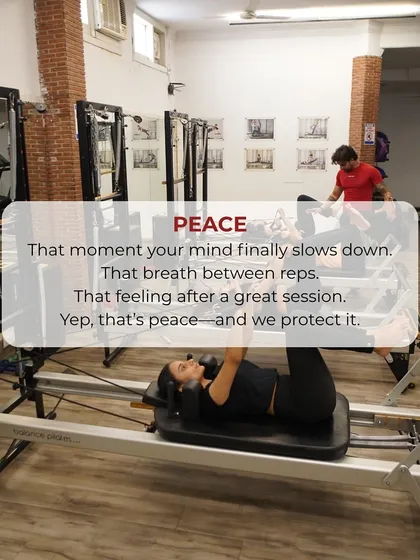 That moment of peace after a great session. A client lies on the reformer, finding stillness and connecting with her breath between reps.