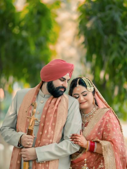 A tender moment with the bride, Ishita, resting her head on the groom's shoulder, their contentment palpable.