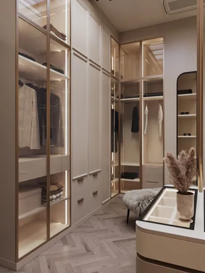 Another angle of the beige walk-in closet, showing the thoughtful layout that maximizes storage while maintaining an open and airy feel.