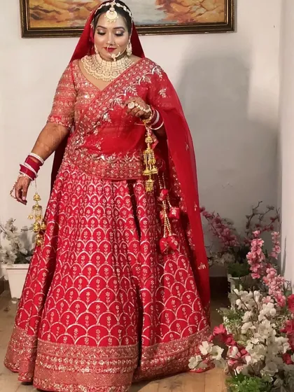 The bride posing with her ghunghat, a timeless look that highlights the traditional beauty of an Indian wedding.