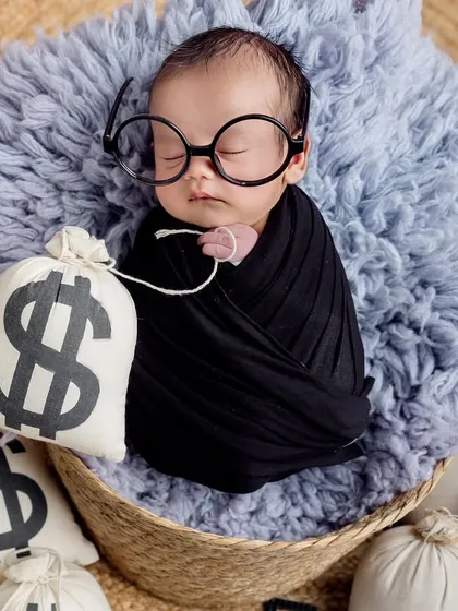 Even the boss needs a nap. A sleepy and adorable shot from a newborn "Boss Baby" session.