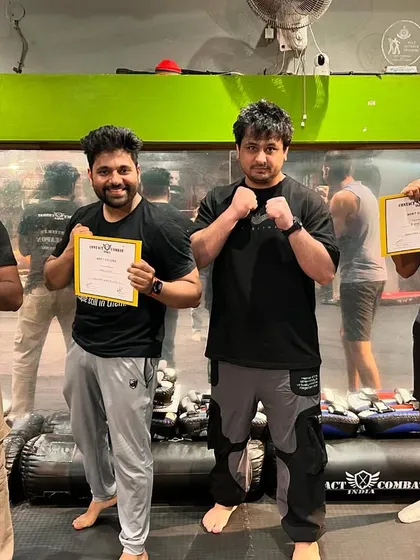A group of students celebrating their successful level tests. They have put in the work and now have the skills and the certificate to prove it.