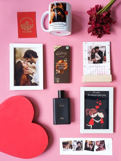 A flat lay of the 'Sweetheart's Delight' hamper, showing every personalized item from the photo mug to the custom calendar and framed pictures.