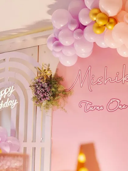This detailed shot showcases the different elements of the backdrop, including the "Happy Birthday" neon sign, the arched paneling, and the fairy silhouette.