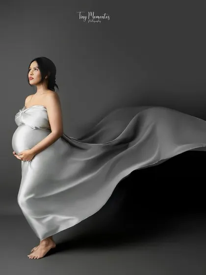 This is the art of waiting. I use flowing fabrics and gentle posing to create fine art maternity portraits that feel both powerful and serene, capturing the goddess within you.