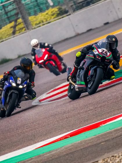 Three riders battling for position through a corner at BIC. Our open track days provide a safe environment for close and competitive riding.