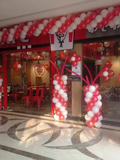 I handle commercial events and shop openings too. Here is the balloon decoration I did for a new KFC outlet, designed to match their brand colors and create an exciting atmosphere for the launch.