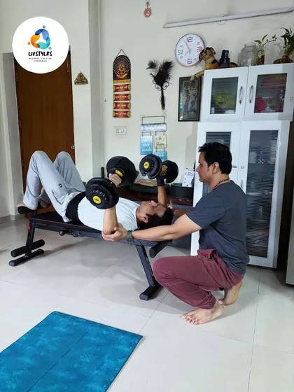 Personal training is about guidance and safety. Here, I am providing hands-on support to a client during a dumbbell bench press, ensuring he maintains perfect form to maximize results and prevent injury.