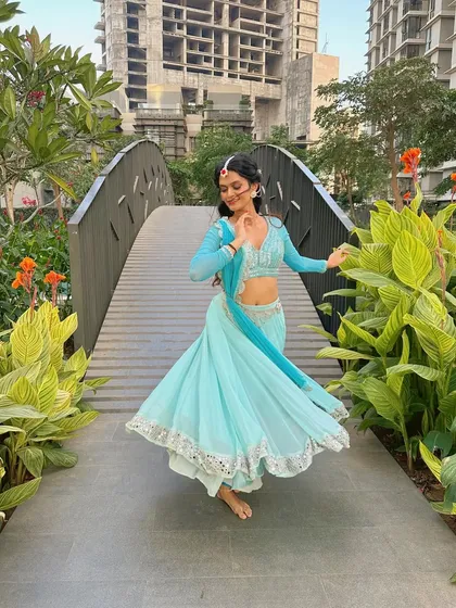A series of photos capturing the twirls and graceful movements of semi-classical dance. The flow of the lehenga is essential to the visual beauty of this style.