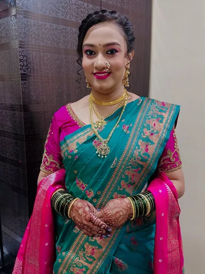 A full-length view of the client, showing her elegant saree and simple, beautiful look.