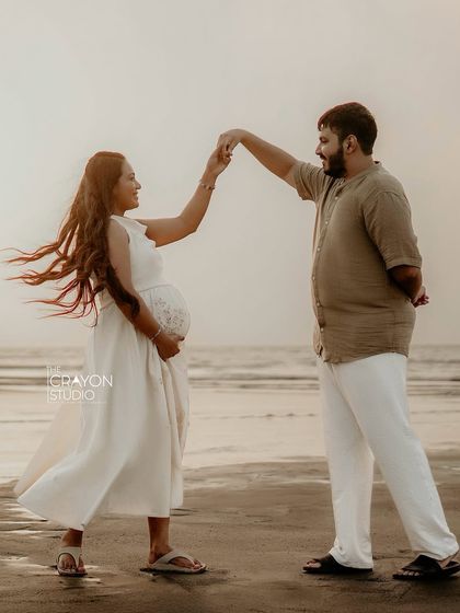 A playful dance on the sand. Outdoor sessions are perfect for capturing spontaneous, joyful interactions that show a couple's unique personality.