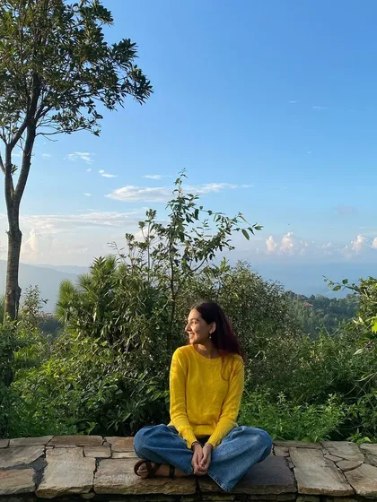 A participant enjoying the morning sun and the mountain air. These moments of quiet joy are what make the retreat experience so rejuvenating.