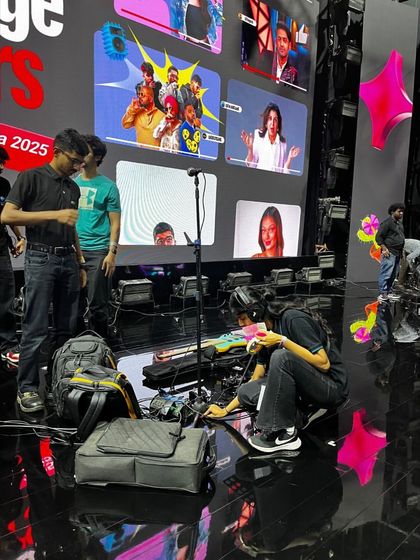 Our crew managing cables and equipment on the complex stage of the YouTube Fan Fest. We maintain a safe and organized technical environment.