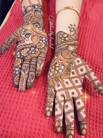 A beautiful, intricate design for Diwali, combining peacocks and floral patterns for a full and festive look.
