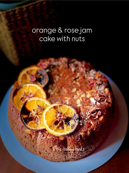 A fragrant cake combining orange and gulkand (rose jam), topped with nuts and candied orange slices. It's a beautiful fusion of flavours.
