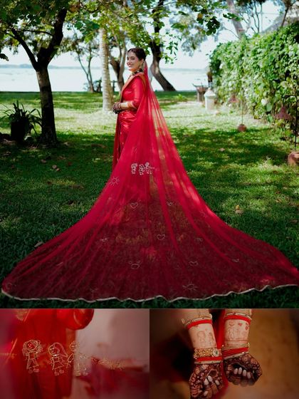 A creative shot showcasing the bride's magnificent long red veil, with details of her henna and the family motif embroidered on the fabric.
