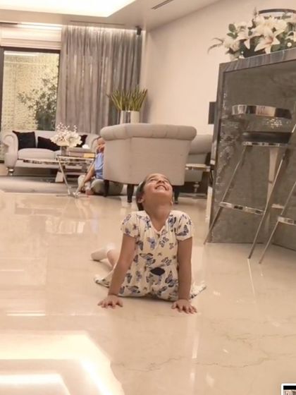 A young student masters the cobra pose, an essential asana for building back strength and improving posture.