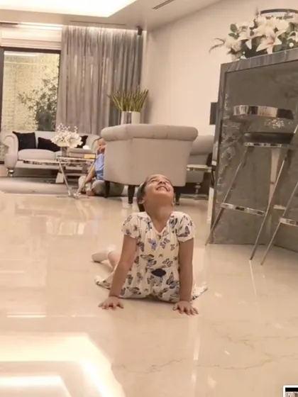 A young student masters the cobra pose, an essential asana for building back strength and improving posture.