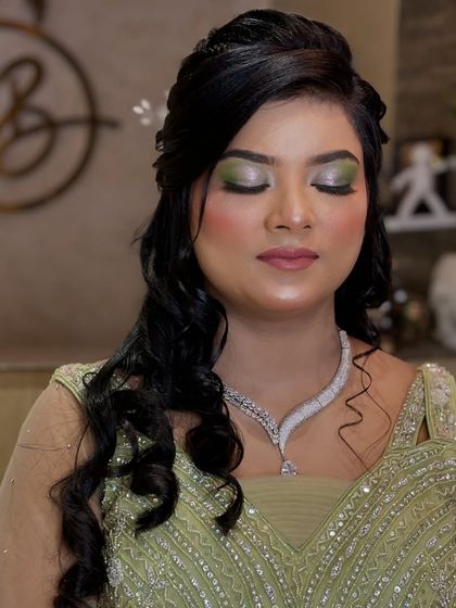 Another view of the green eyeshadow look, showing how it brightens the eyes.
