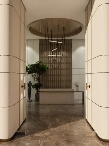 A symmetrical design creates a sense of formal balance and grandeur in this lobby. Twin seating areas flank a central reception, guiding visitors into the space.