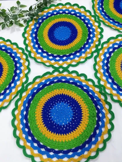 Inspired by the vibrant colors of a peacock, these placemats are one of my most popular items. They are perfect for adding a splash of color to your dining table or as a decorative mat for a centerpiece.