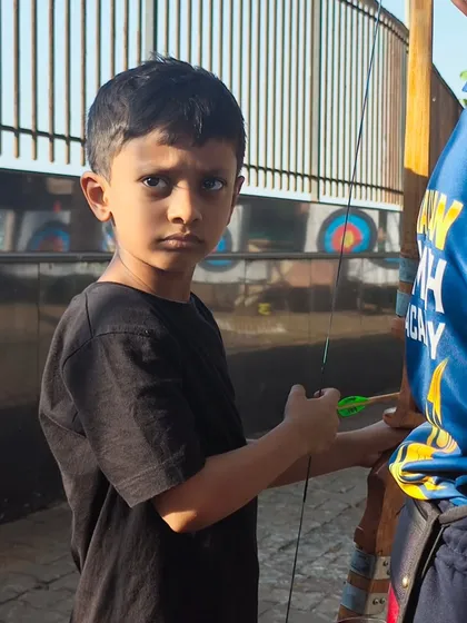 The intense focus of a young boy preparing to shoot. These trials are as much about mental discipline as they are about physical skill.