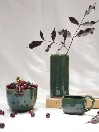 A collection of pieces finished with our Lush Green glaze. This versatile, stable glaze offers a rich forest green hue with subtle blue speckles, working beautifully on both light and dark stoneware clay bodies.