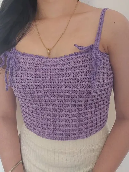 The front view of the Aurelia Top, highlighting the unique texture and flattering shape.