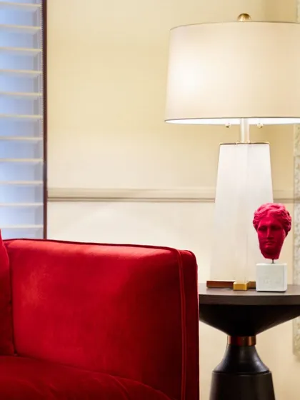 In the Godrej Experience Centre at The Imperial Hotel, we blended heritage with modernity. A bold red sculpture and contemporary lamp stand beside a plush velvet armchair, creating a striking contrast that honors the historical context while feeling fresh and relevant.