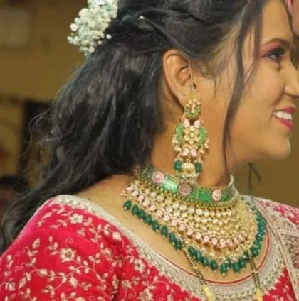 A side view highlighting the beautiful earrings and the intricate details of the choker. The combination of green enamel and pink beads is simply stunning.
