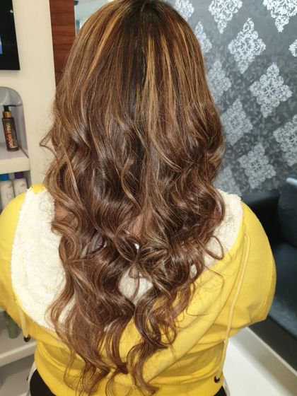 Another shot of the subtle highlights, showing how they look from the back. The color gives the hair a healthy, glossy finish without being too dramatic.